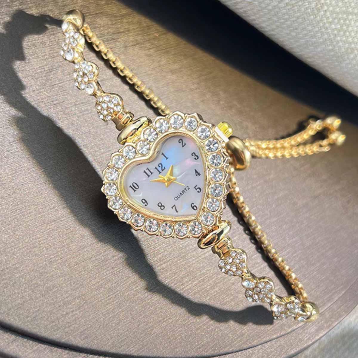 新しいファッションハート型リボンストラップダイヤモンドがちり - Open Heart Watch のレビューと価格